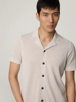 Strickpolo im Slim Fit